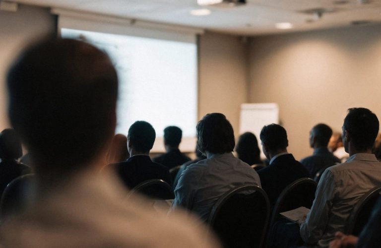 Presentatie op podium voor sportvoeding lezing